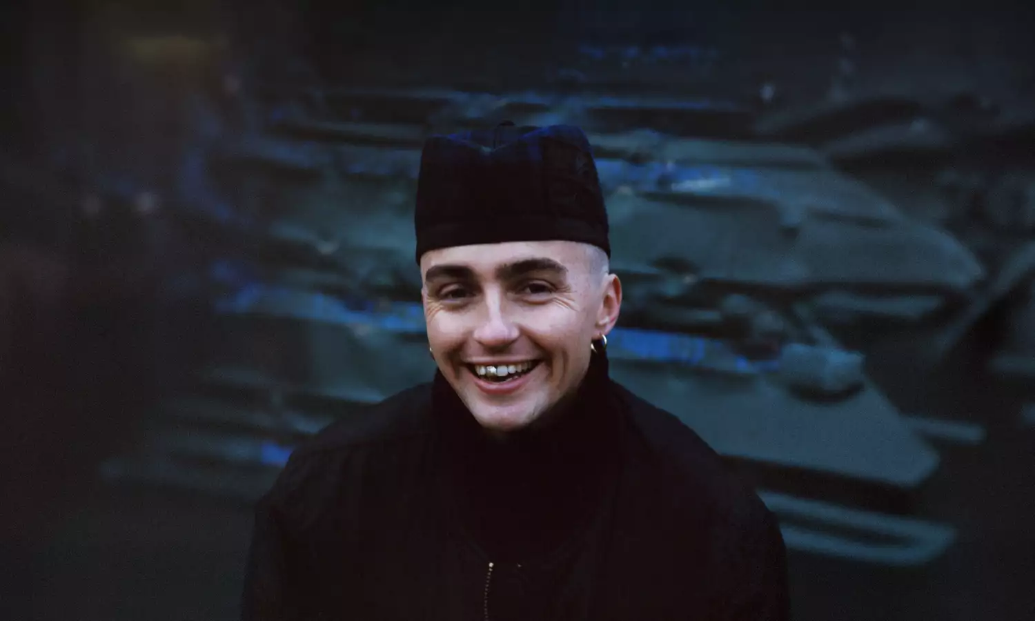 Trackie McLeod wearing all black and smiling