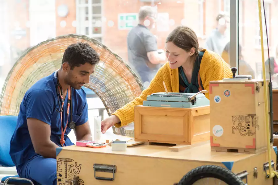 Photo of two people creating crafts