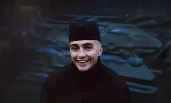 Trackie McLeod wearing all black and smiling