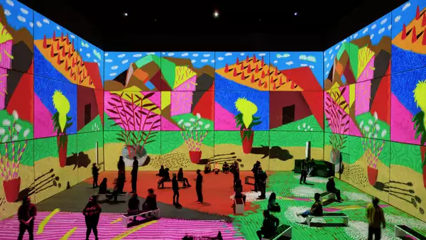 People inside the Bigger & Closer exhibition at Aviva Studios