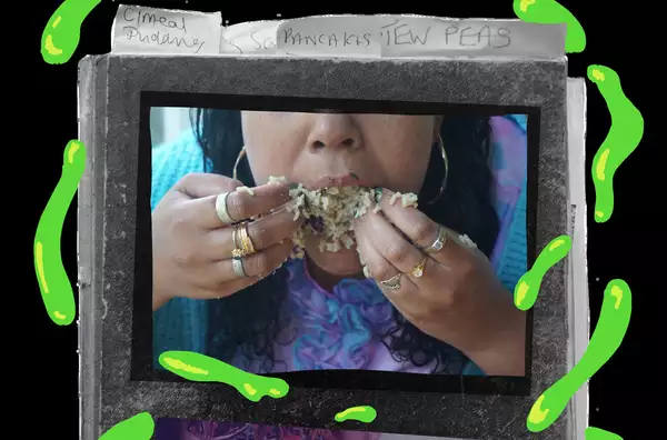 A person eats rice with their hands. They wear a number of gold rings and hooped gold earrings. Their picture sits on the cover of a recipe book which is illustrated with bright green shapes.