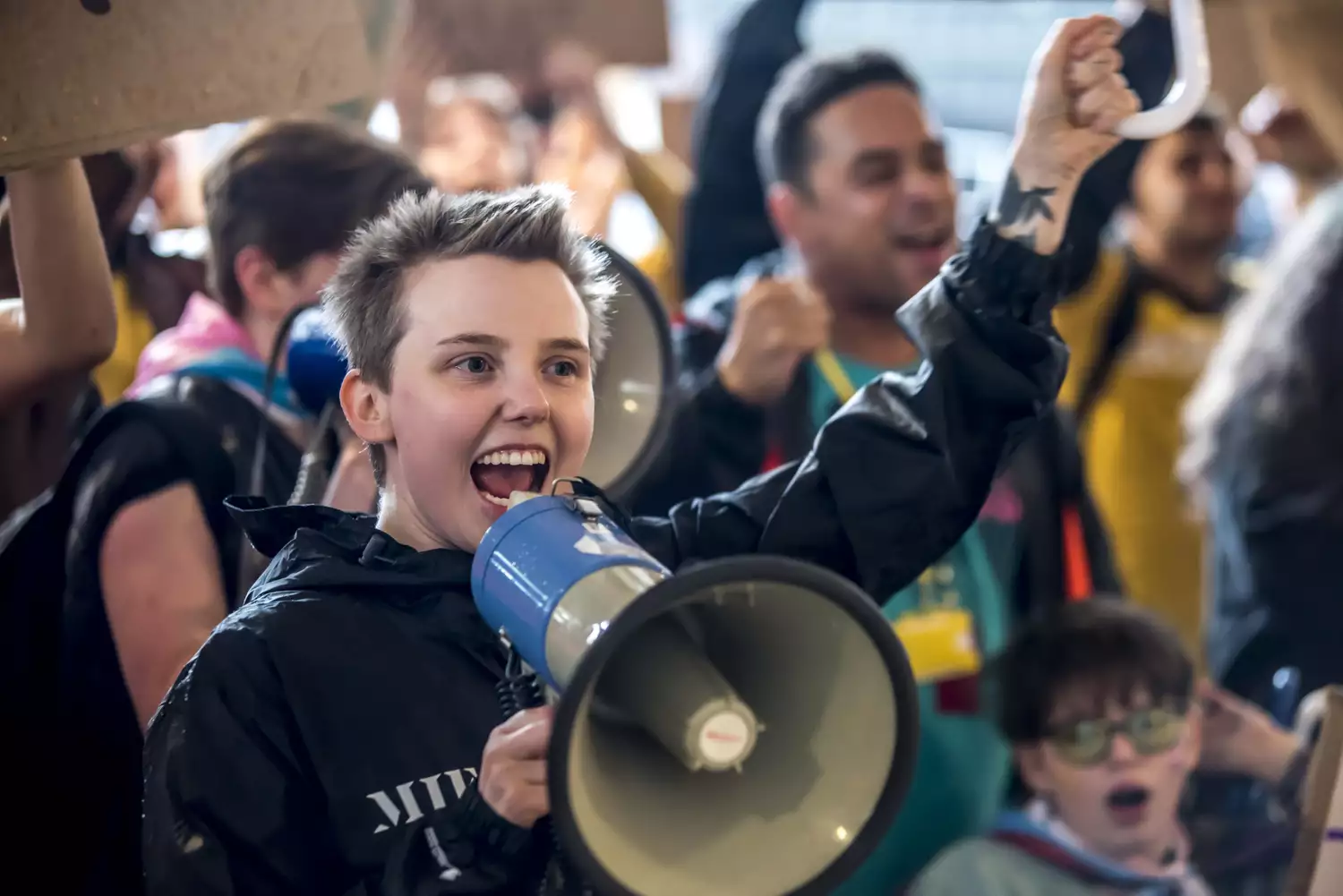 A member of Balmy Army shouting into a megaphone during the march