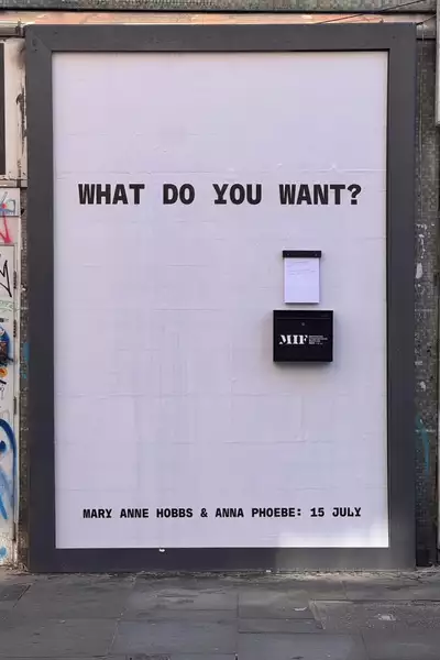 An empty billboard with the words 'What do you want?'