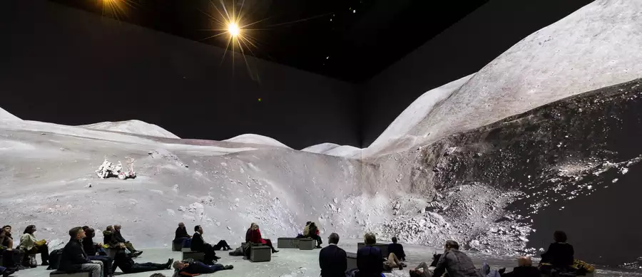 People watching The Moonwalkers, showing a scene on the moon