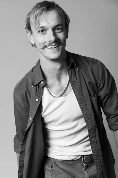 Black and white headshot of Adam Strom