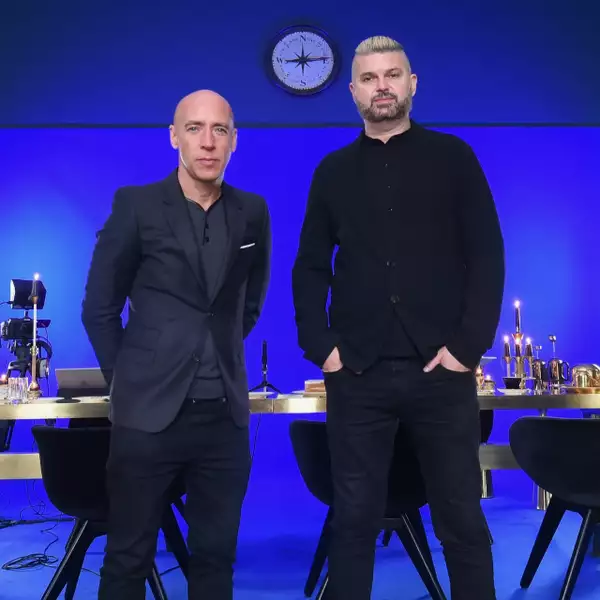 Photograph of AL and AL wearing all black clothing