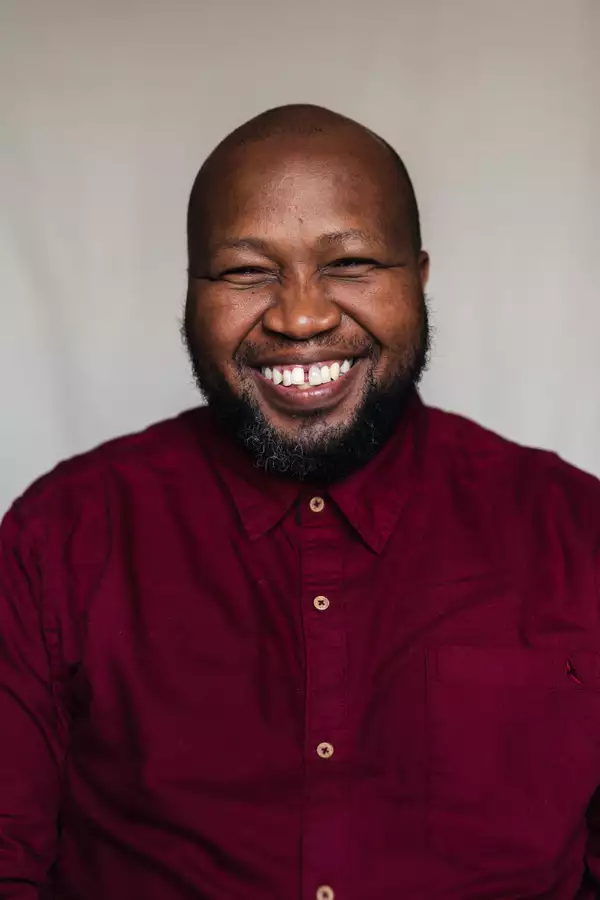 Mandla Gaduka in a red shirt