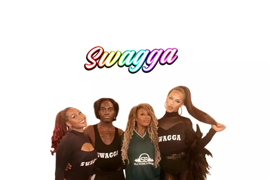 Four members of the SWAGGA collective pose together in performance outfits against a white background. Three wear black outfits with the word 'SWAGGA' printed on them, and one wears a green jersey with 'DJ Stacy Bee' on the front. Above them, the word 'Swagga' is written in a bold, rainbow-gradient font."