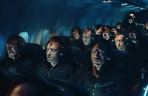 A surreal airplane cabin filled with identical men wearing headphones.