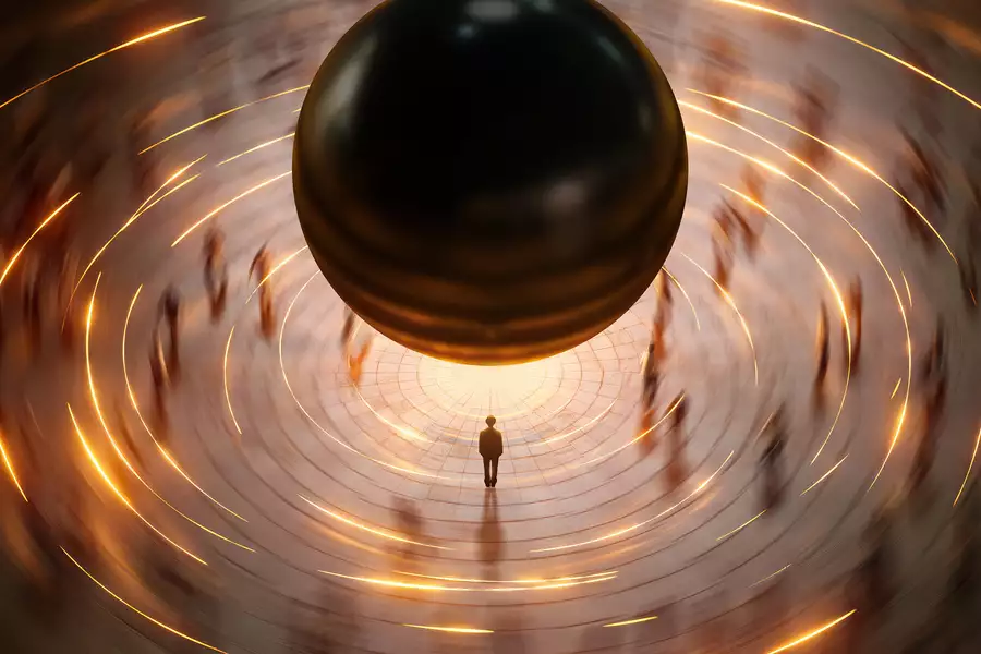 A lone figure stands beneath a massive black sphere, surrounded by swirling golden light trails