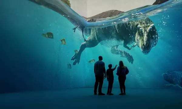 Three people looking at a giant dinosaur swimming in Lightroom