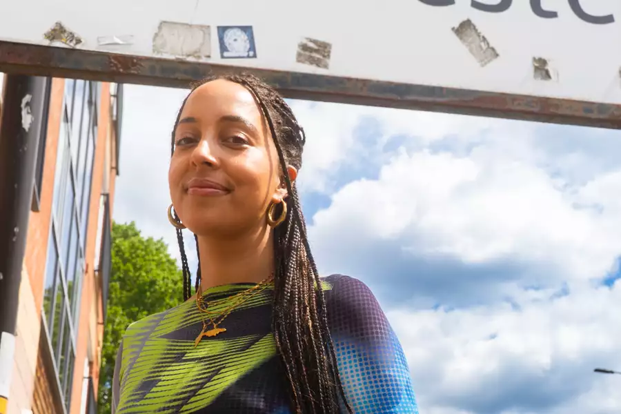 Stefanie Reynolds stood outside underneath a road sign