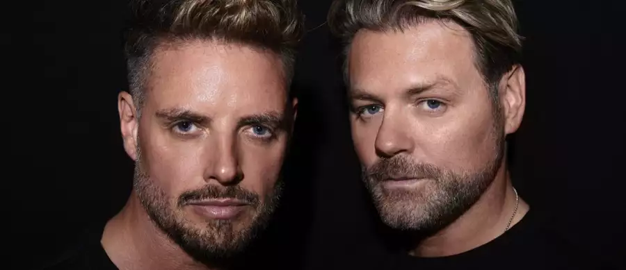 Keith Duffy and Brian McFadden on a black background