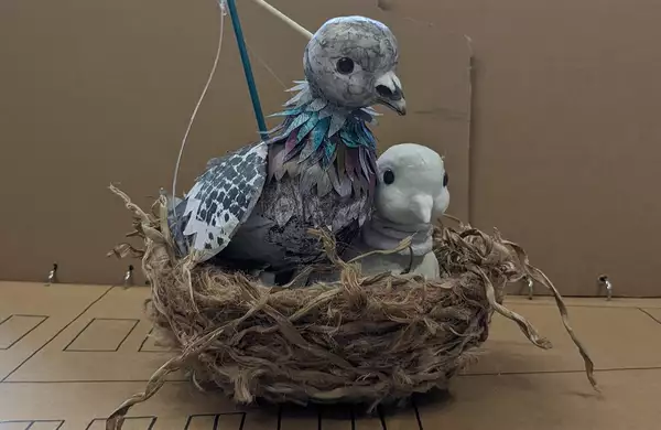 A puppet bird sitting in a nest