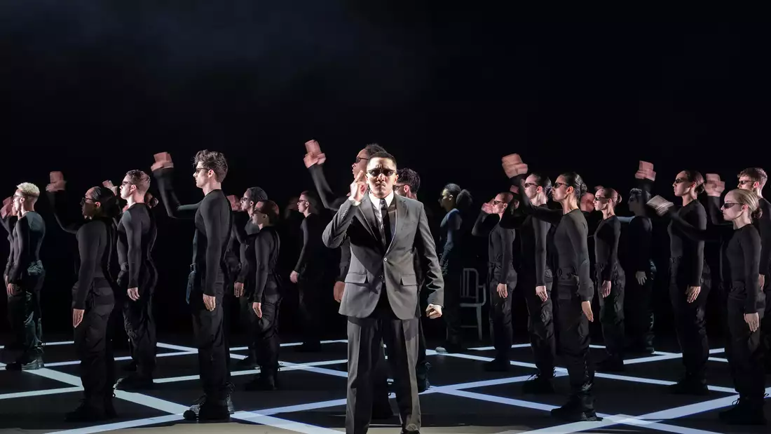 Dancers in Free Your Mind wearing black clothing with sunglasses