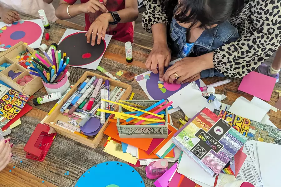 Children and adults take part in colouring in