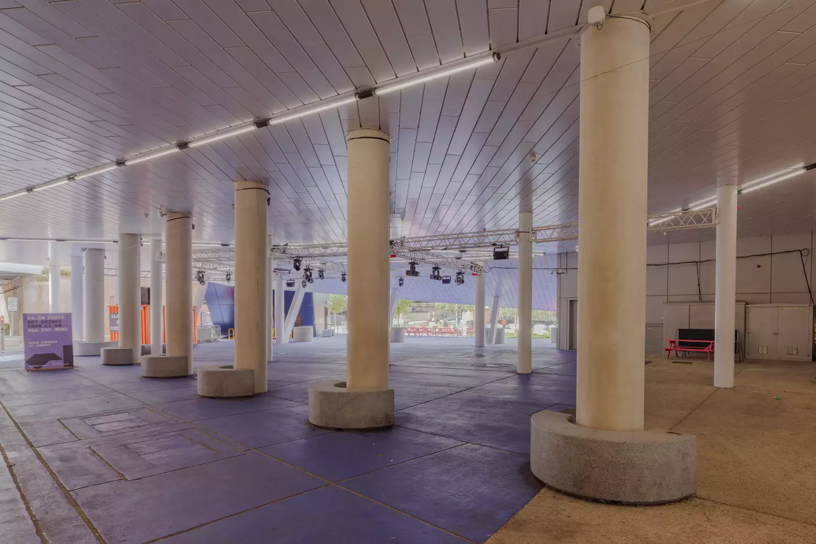 The pillars in the Undercroft on purple flooring