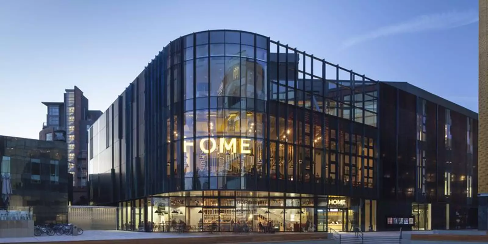 The exterior of the HOME Manchester building photographed at dusk