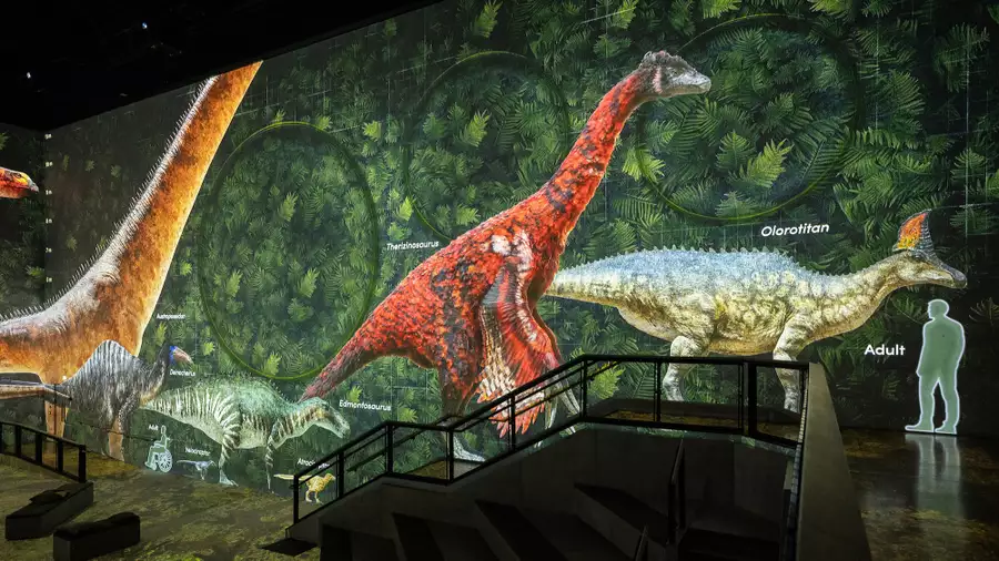 An image from Lightroom's Prehistoric Planet: Discovering Dinosaurs showing dinosaurs labelled on screen next to a human for scale