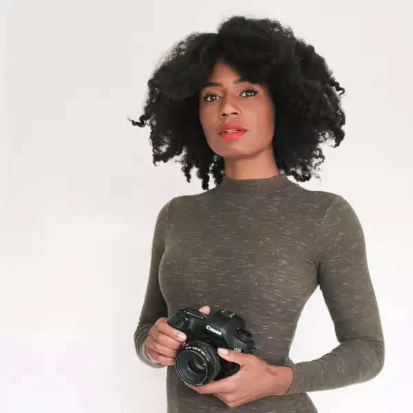 Photo of Tanya Weekes holding a camera