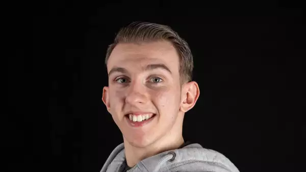 Headshot of Jake Smith on a black background