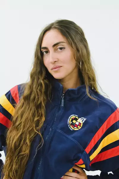 Irene Gonzalez wearing a dark blue, red and yellow jacket