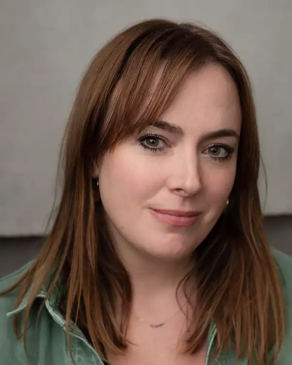 Headshot of Jess Williams wearing a green shirt