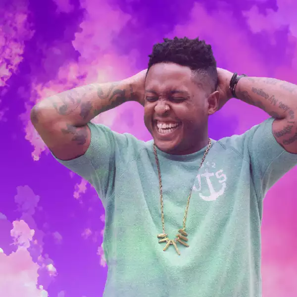 A portrait of Danez Smith on a background of dreamy purple clouds