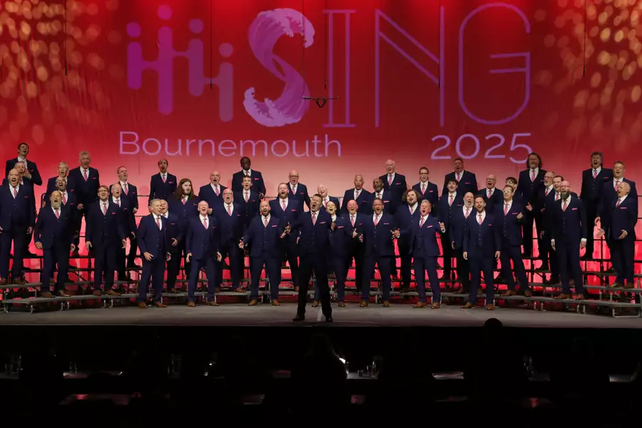 A large group of Cottontown singers performing on stage