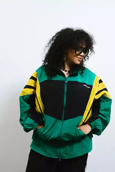 Toni McCoy Hopwood wearing a green and yellow Adidas jacket