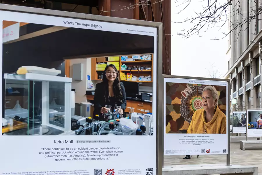 Two photos displayed outdoors as part of the WOW Hope Brigade