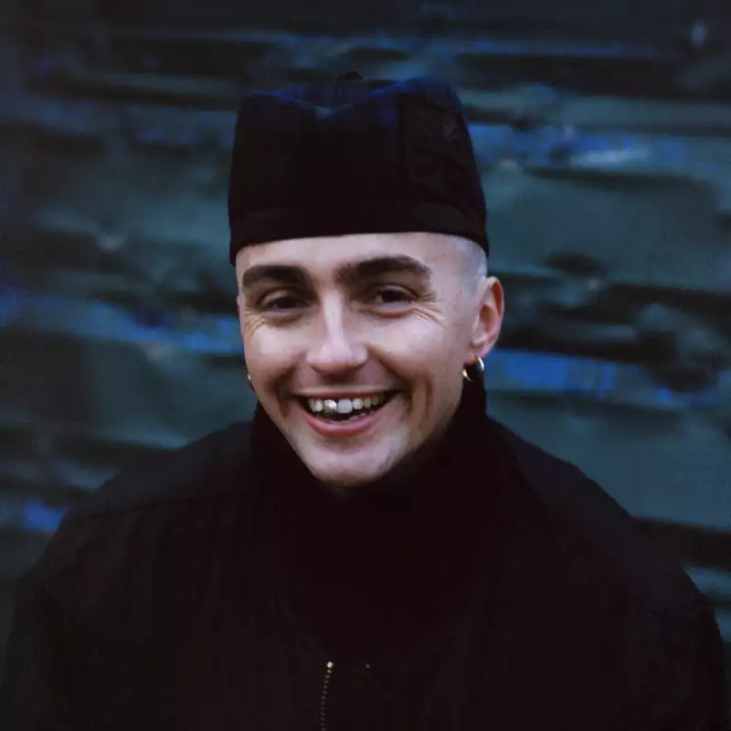 Trackie McLeod wearing all black and smiling