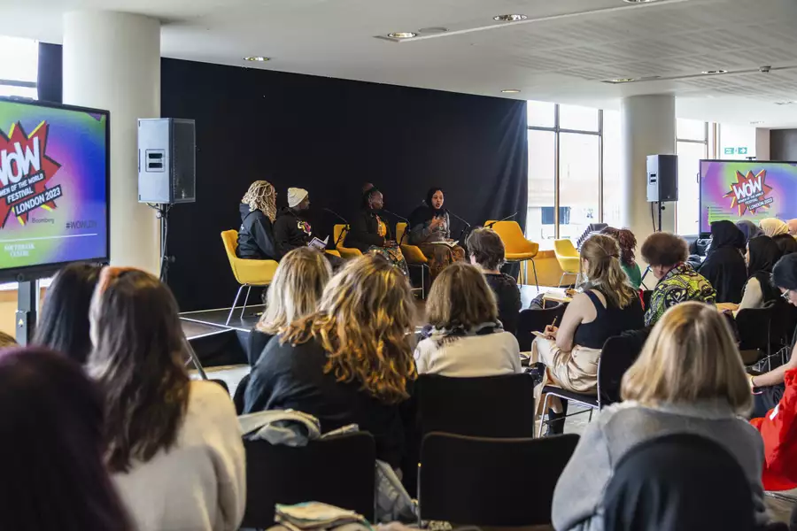 A Girl Generation panel event at WOW Manchester – 4 people on stage with a large audience