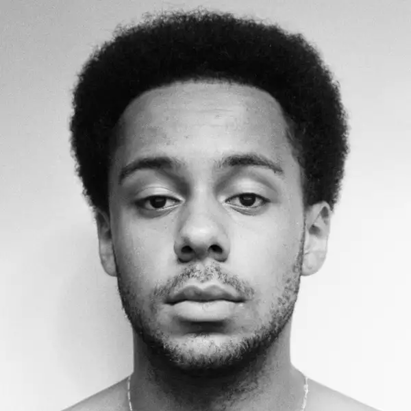 Black and white headshot of Timon Benson