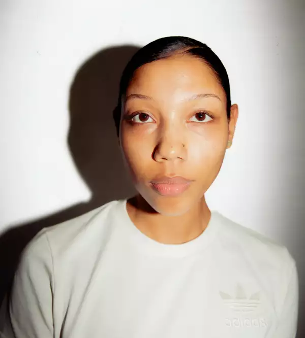 Ella Murray wearing a white Adidas top on a white background