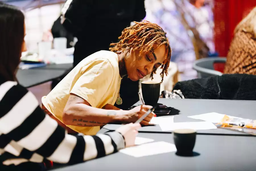 A person writing at a table