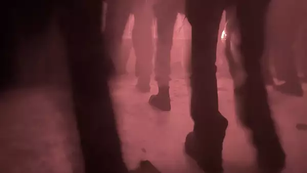 a crowd of people's legs and shoes on the dance floor
