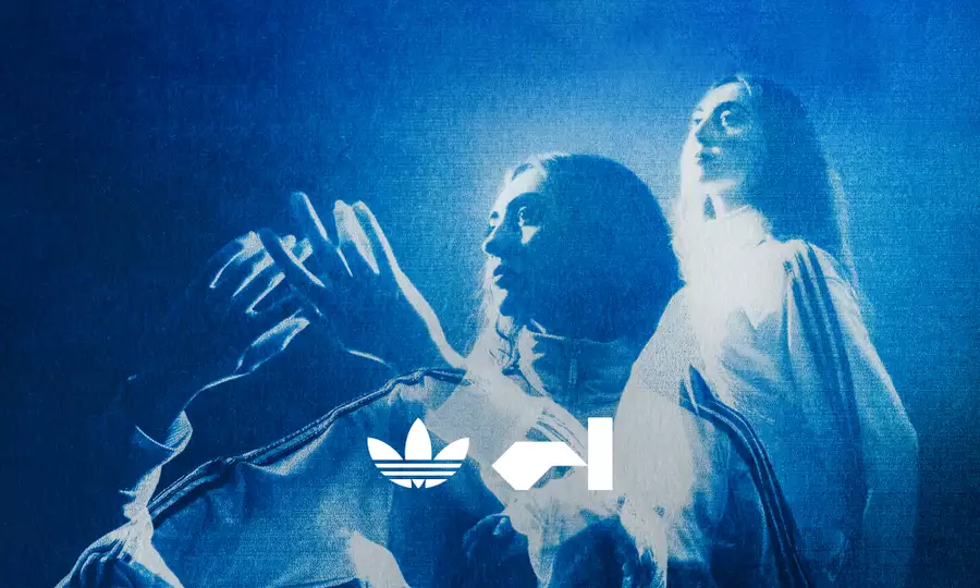 Person dancing with raised hands in blue light, with others behind them. The adidas and Factory International logos are at the bottom.