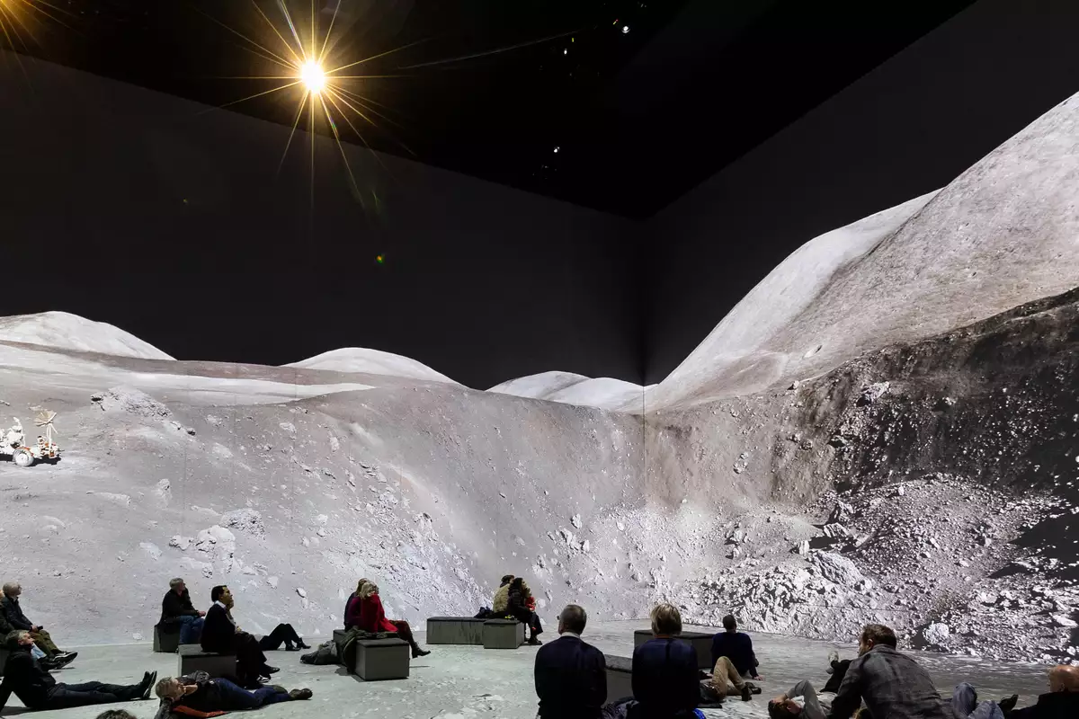 People watching The Moonwalkers, showing a scene on the moon