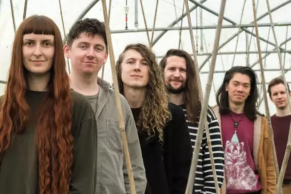 Six members of Caraway stood in a line outside