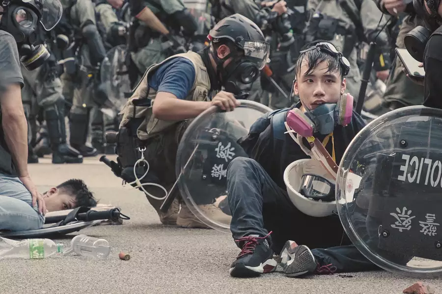 Protestors being held on the ground by police in Hong Kong