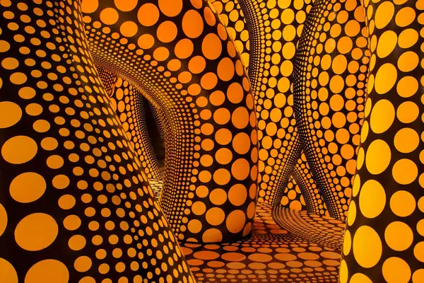 Yayoi Kusama artwork of large inflatable yellow tentacles with black polkadots on them