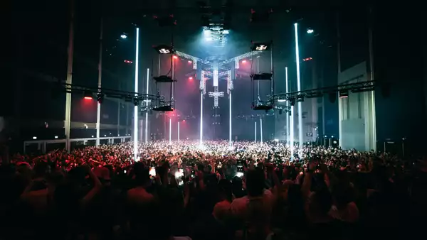 A large crowd of people in the Warehouse during a big music gig