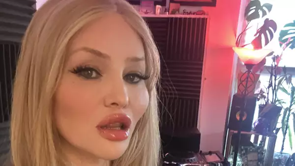 Kim Lana DJing with plants and a floor lamp in the background