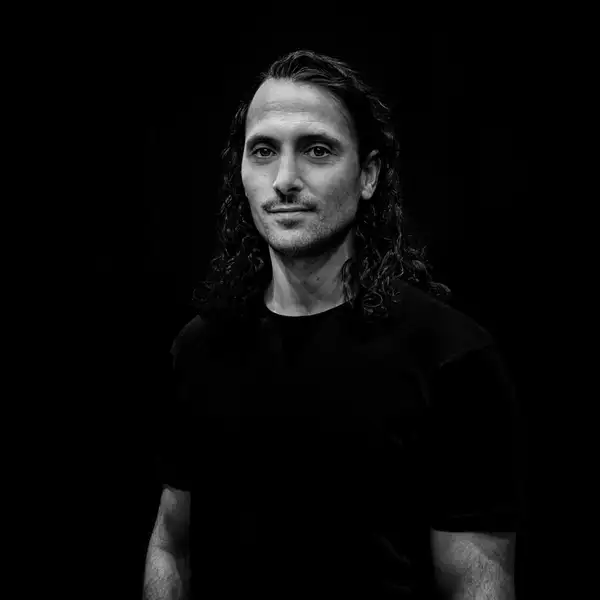 Black and white headshot of Blenard Azizaj