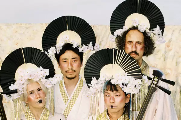 Four members of Mitsune wearing traditional Japanese clothing