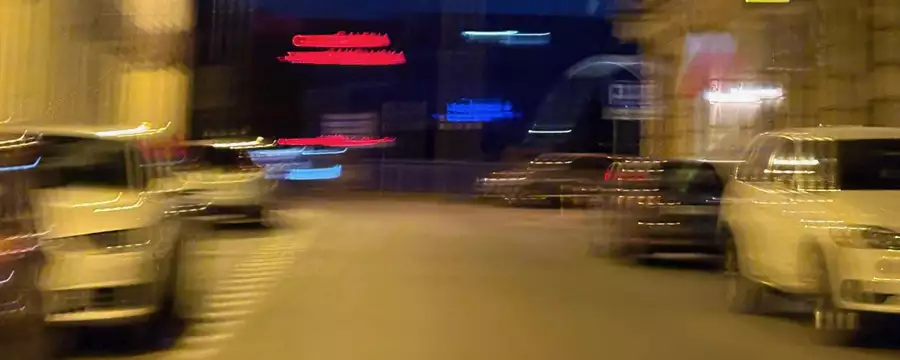 A blurry photo of a street at night