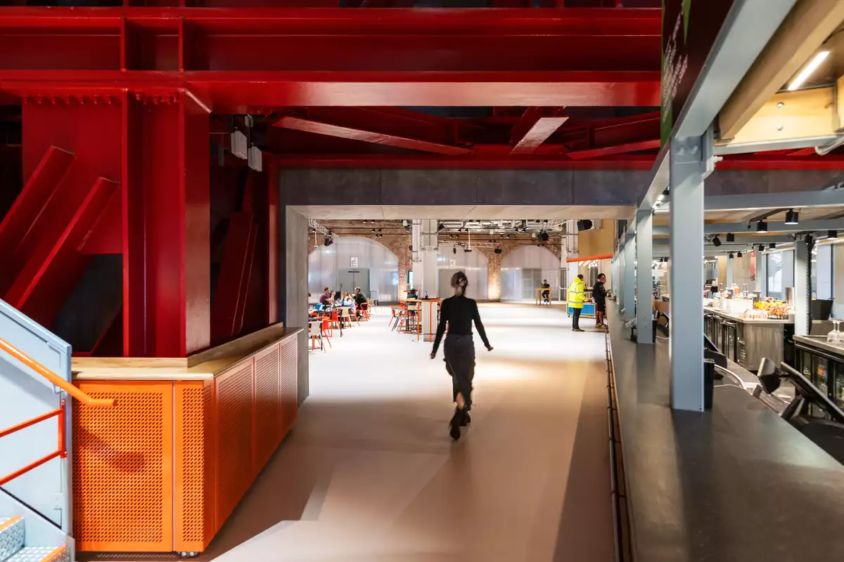 Photo of a visitor walking into the Social