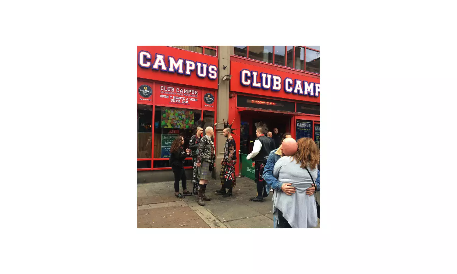 “KISS FROM A ROSE” by Trackie McLeod, showing a photograph of people outside Club Campus