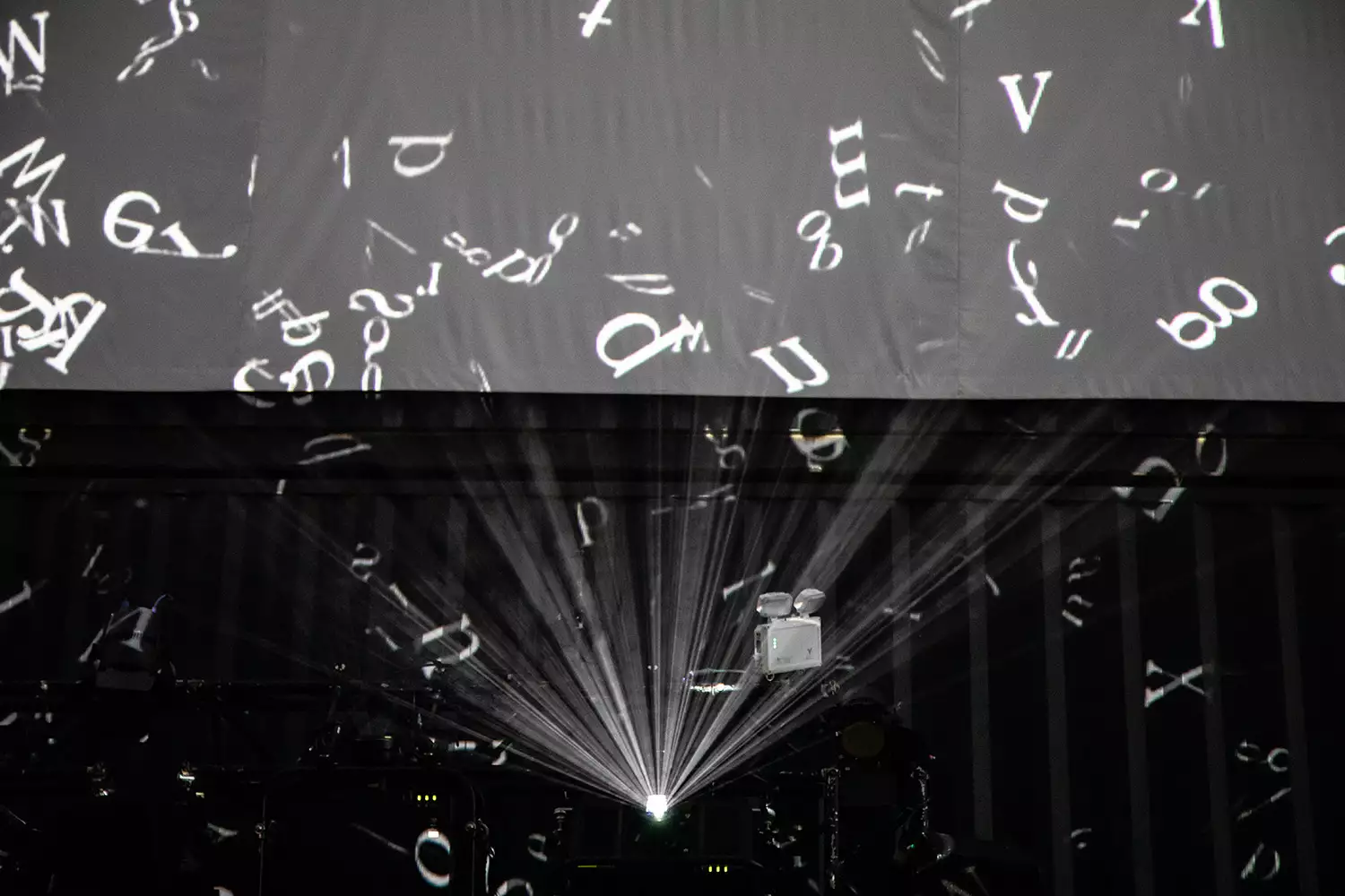 white letters projected onto a black background